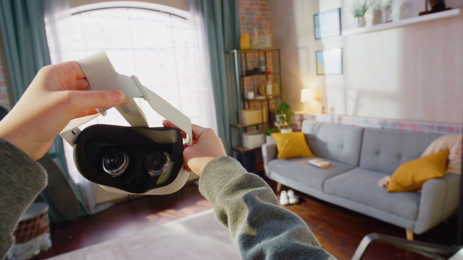 Person putting on virtual reality goggles